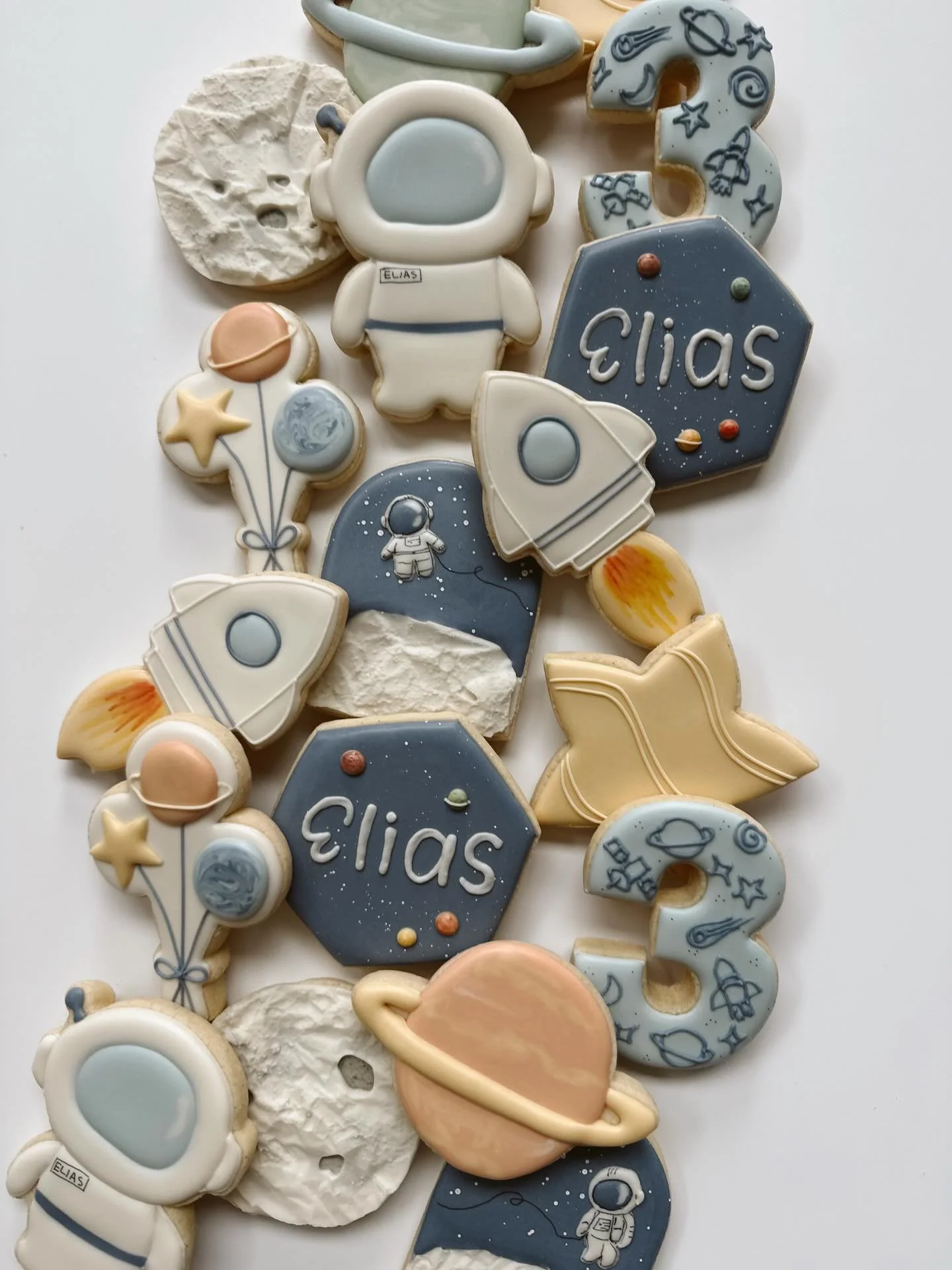 Custom themed birthday cookies will make your party out of this world! 🪐🚀🧑🏻&zwj;🚀 Book now for all your spring events at bio 💫
.
.
#customcookiesbozeman #sugarcookies #dyefree #bozeman #birthdaycookies