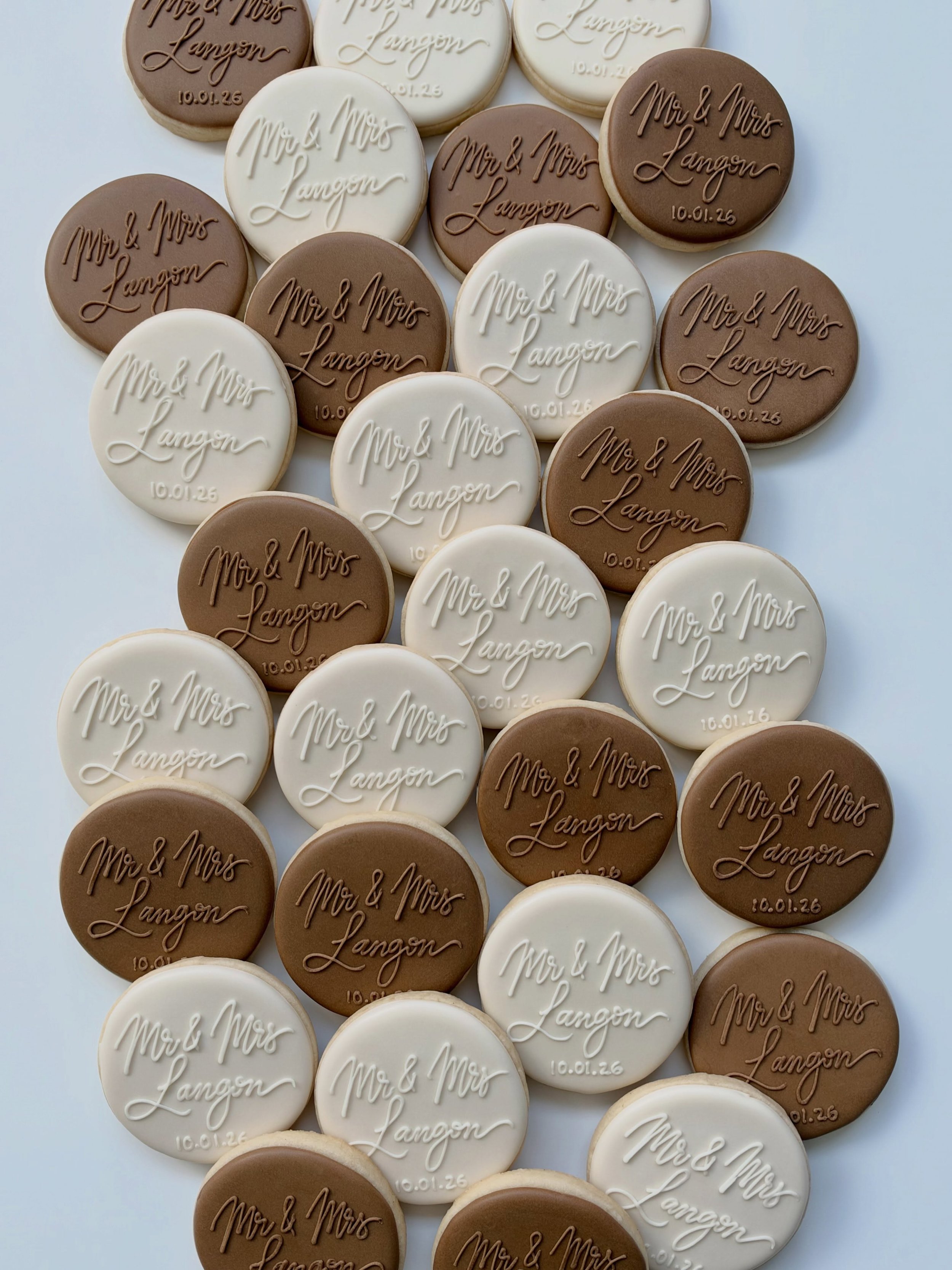 Classic and Timeless Wedding Cookies 🤍🤎 
.
.
#customcookiesbozeman #sugarcookies #weddingcookies #bozeman #dyefree