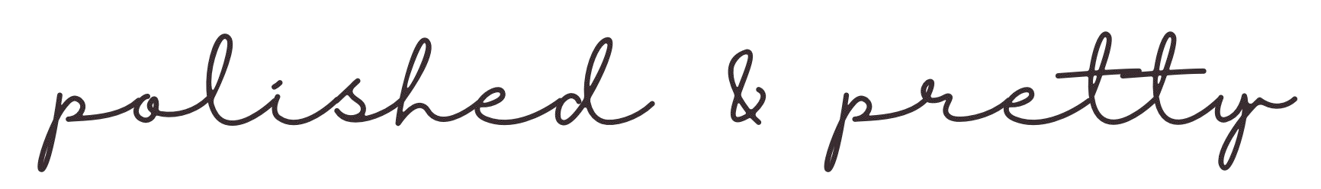 Close-up of black cursive text on a white background reading 'polished & pretty'.