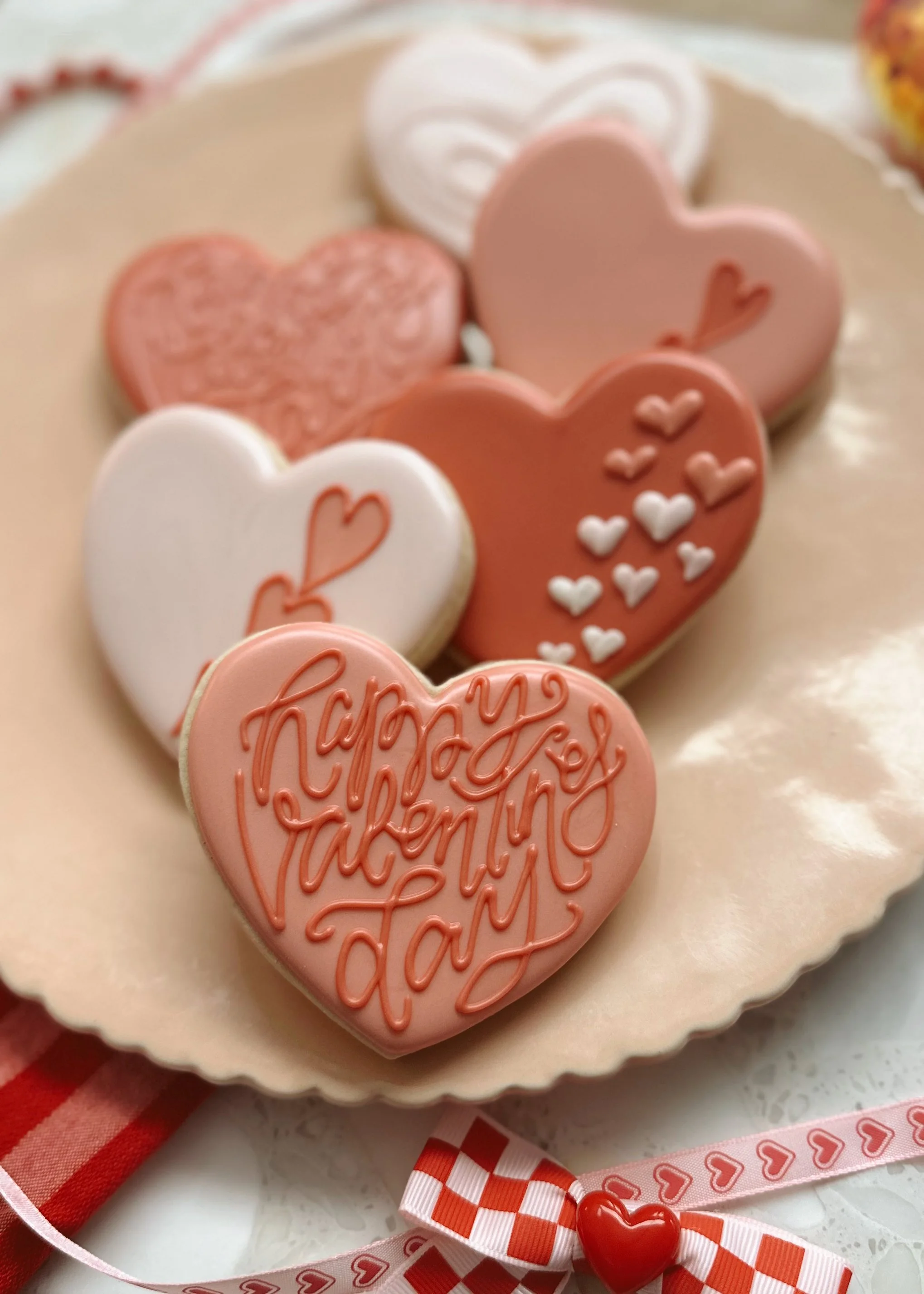 A gift box filled with Valentine's Day decorated cookies.