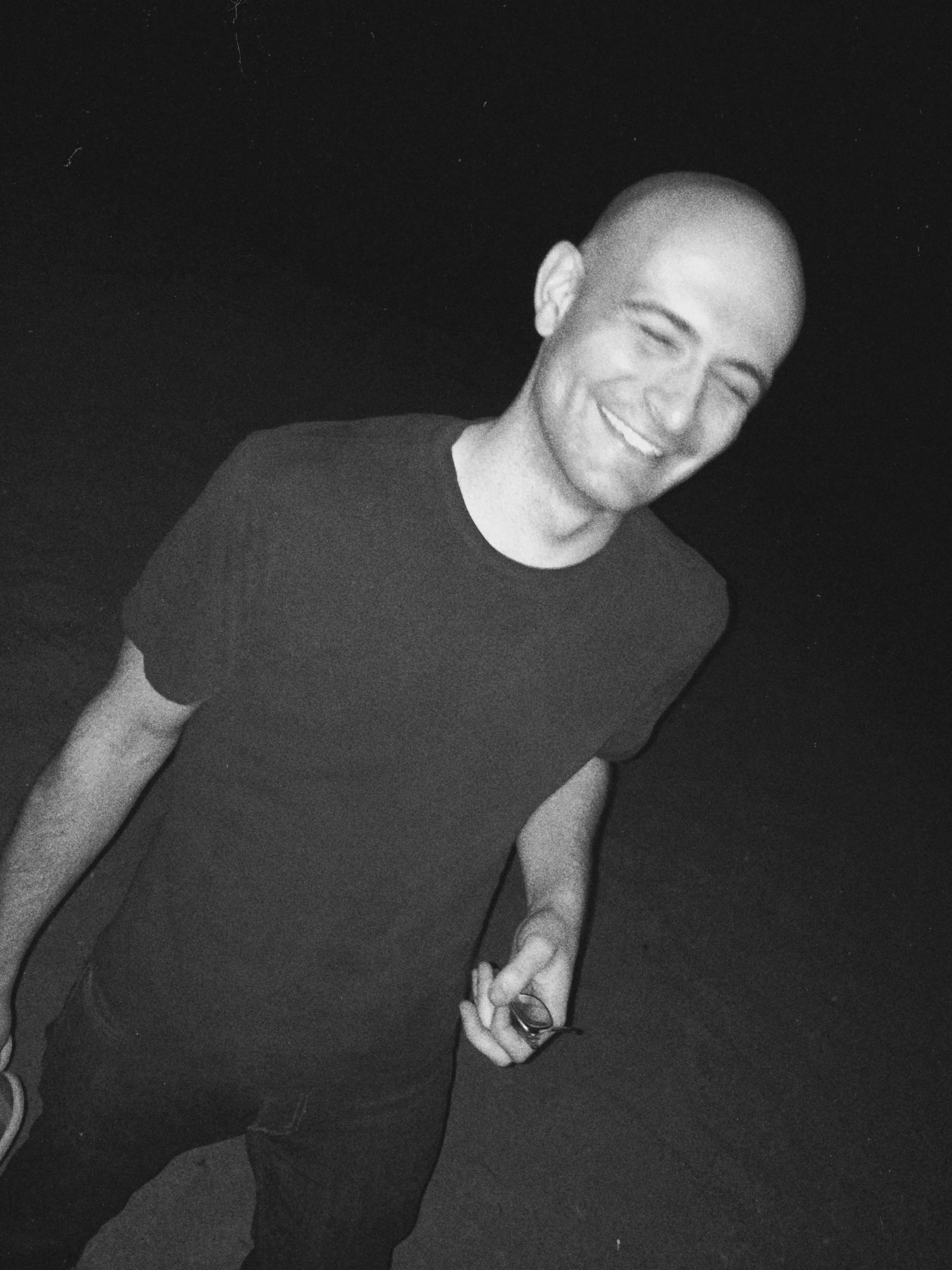 black and white snapsot of me walking on the beach at night