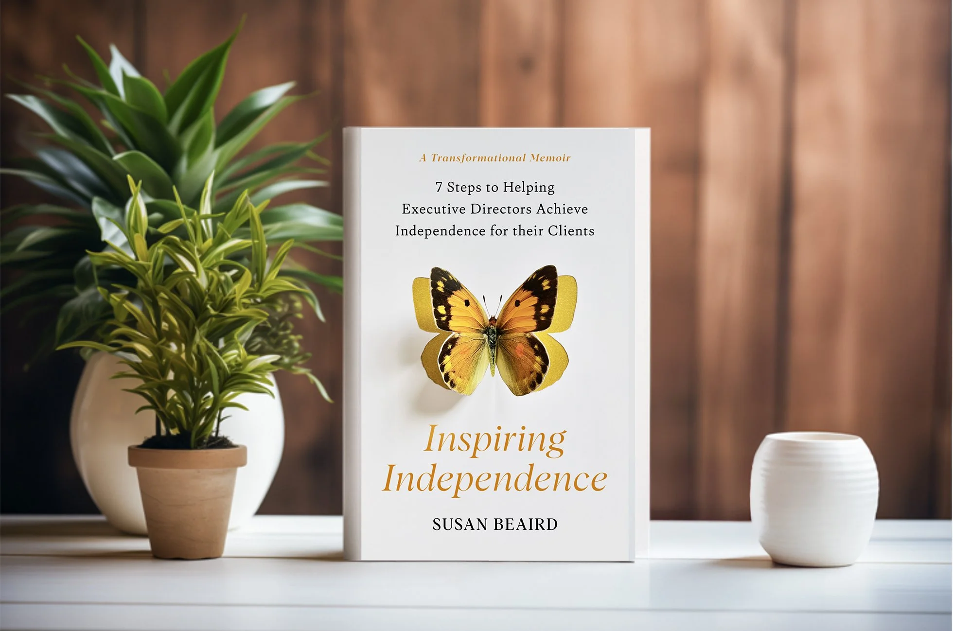 Inspiring Independence: 7 steps to helping executive directors achieve independence for their clients by Susan Beaird. Book has a beautiful yellow butterflly that looks like it's flying off the front cover.