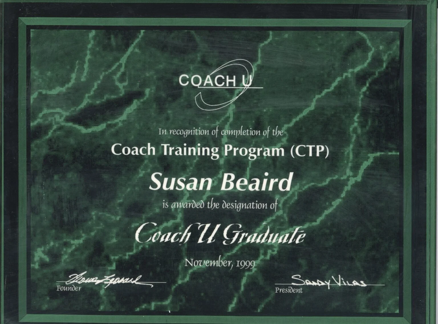 Certificate awarded to Susan Beaird for completing the Coach U Graduate program, dated November 1999, with signatures of the founder and president on a green marble background.
