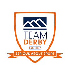 A logo for Team Derby featuring stylized mountains, the words 'TEAM DERBY,' 'Est. 2005,' and a banner with the slogan 'SERIOUS ABOUT SPORT' in orange.