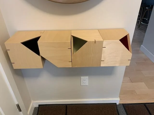 Floating entry hall cubes- four individual pieces put together- Maple plywood & walnut biscuits for reinforcement and for design

