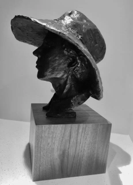 A man with a gardening hat
