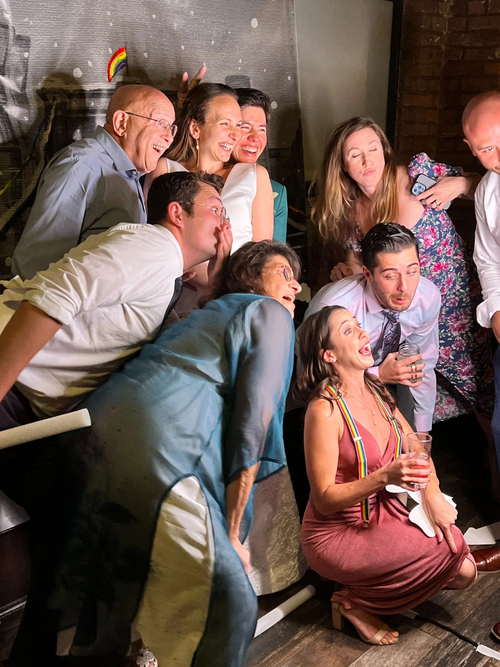 Wedding guests posing in a group at the photo booth, captured during a fun NYC reception with Aria Melody DJ.”“Wedding guests posing in a group at the photo booth, captured during a fun NYC reception with Aria Melody DJ.