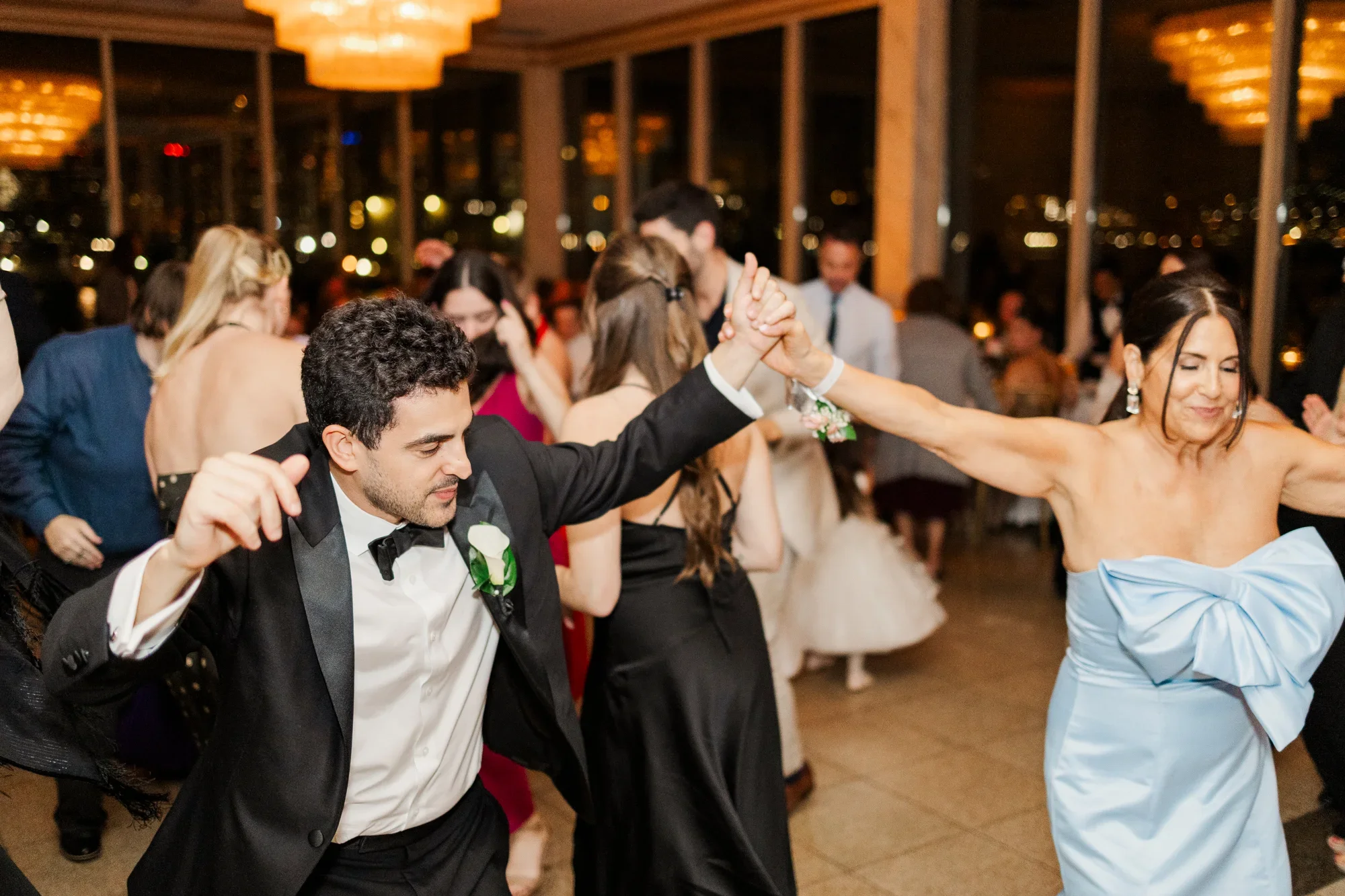 Joyful guest celebrating at a Manhattan wedding reception with Aria Melody, the best wedding DJ in New York City.