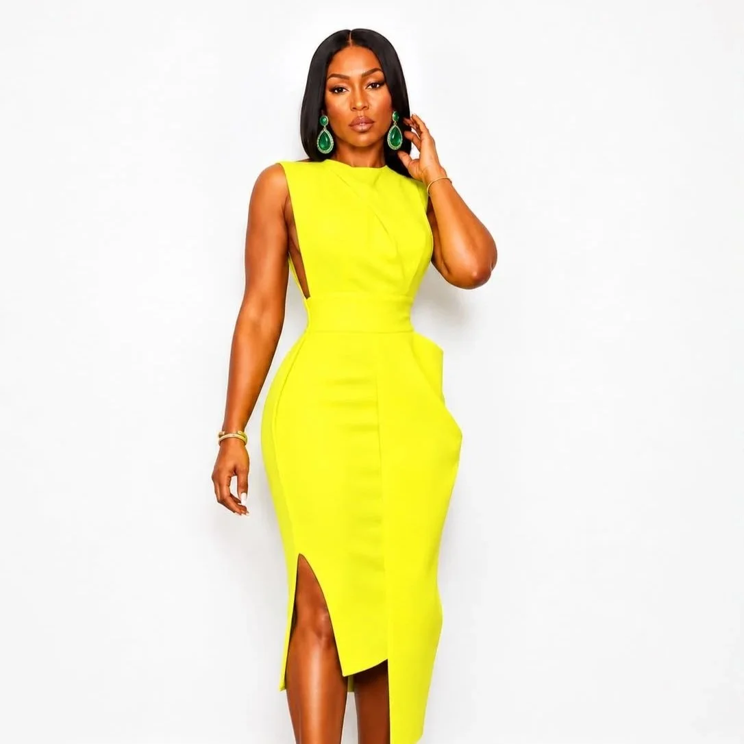 Queen Rocking that Sunflower Yellow Dress