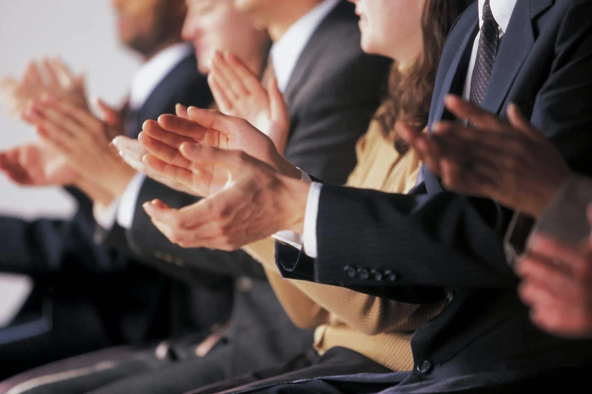 people clapping during a keynote presentation