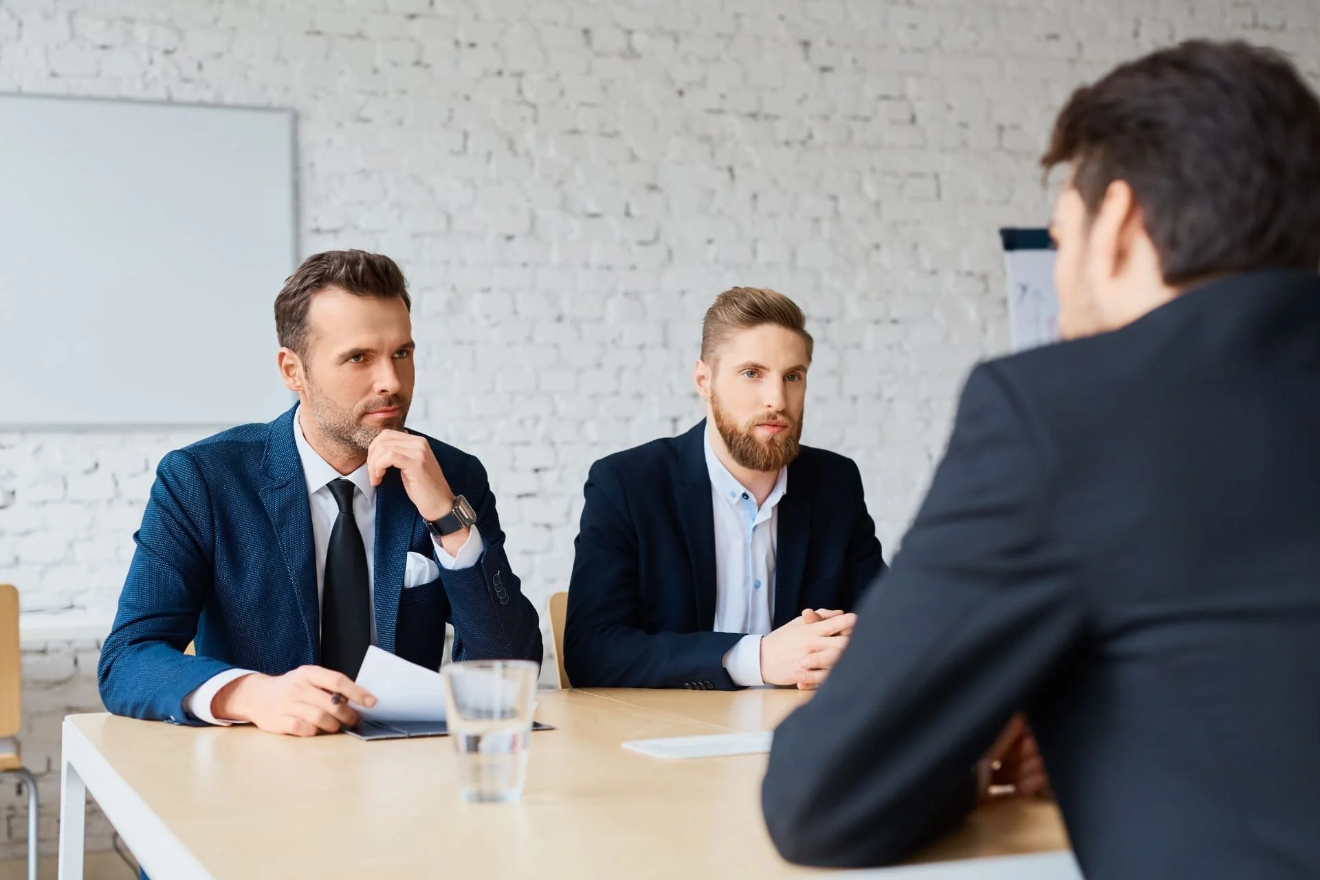 Corporate reciters interviewing a candidate at a table