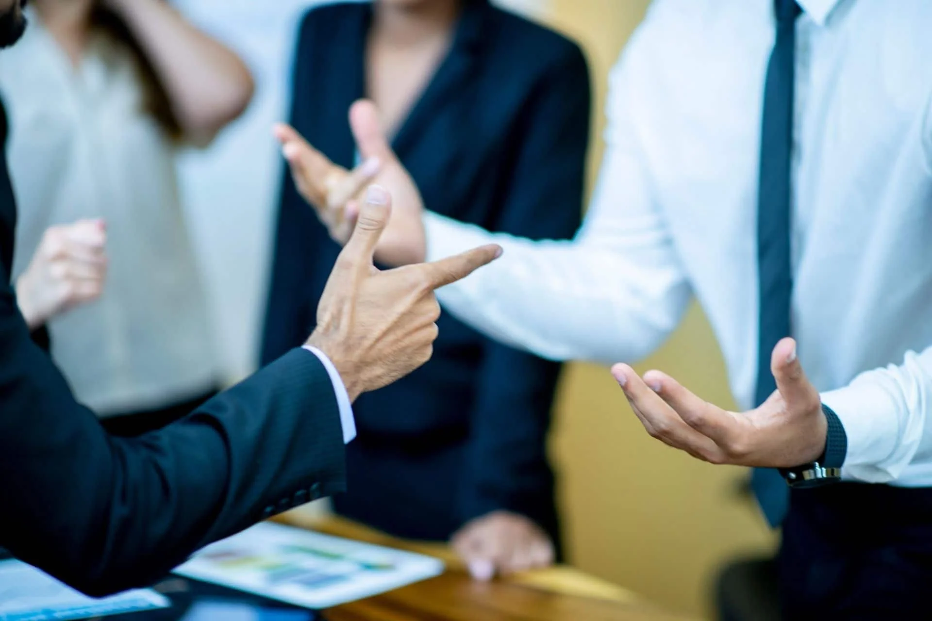 Business colleagues engaged in a heated but constructive discussion at a conference table