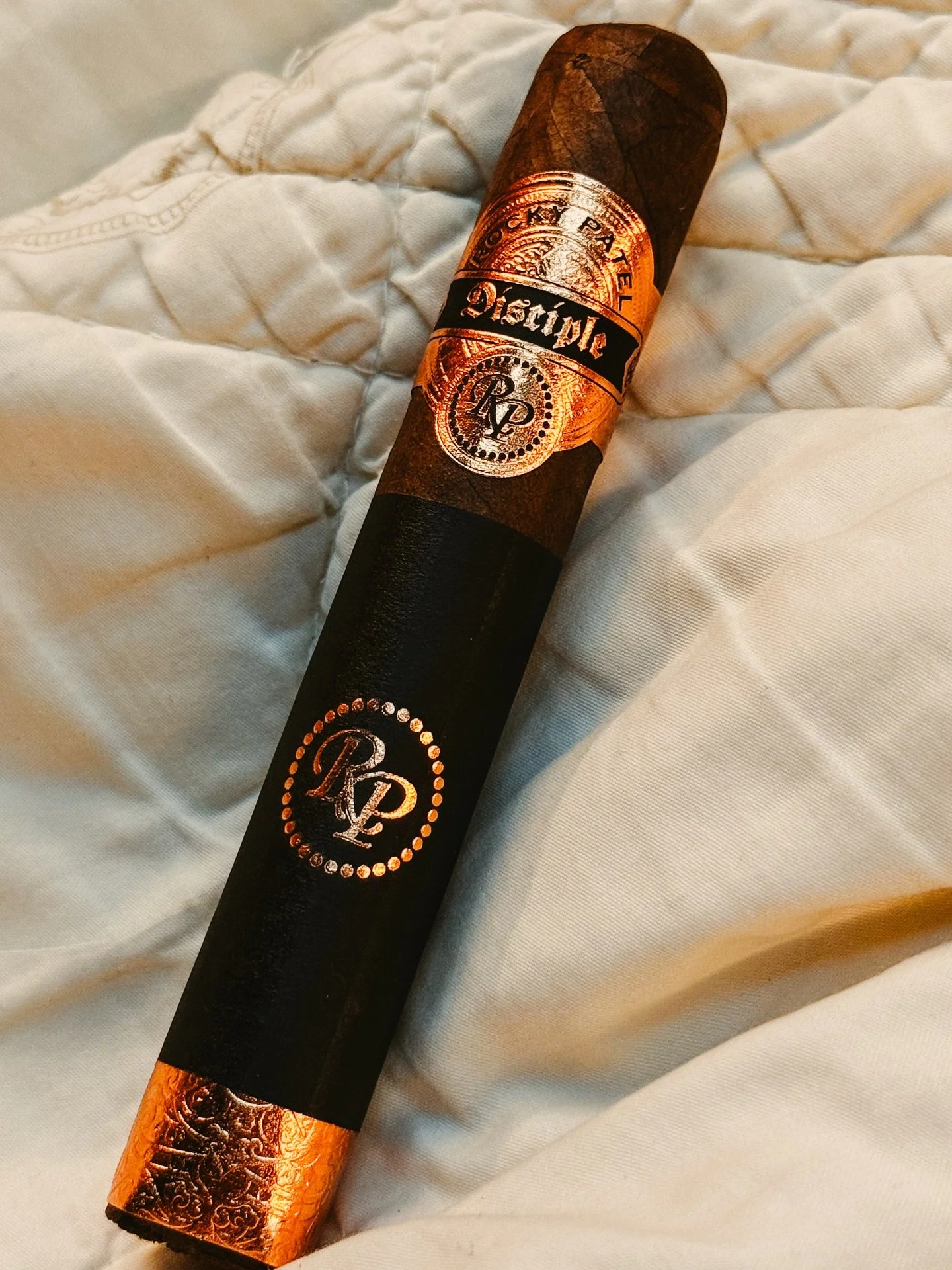 Are cigars better than cigarettes?
Short answer: No&mdash;neither is &ldquo;better&rdquo; for your health. Different ritual, different intent.
-
Tonight&rsquo;s smoke: Rocky Patel Disciple Robusto &mdash; dark chocolate, espresso, cedar; slow, even b