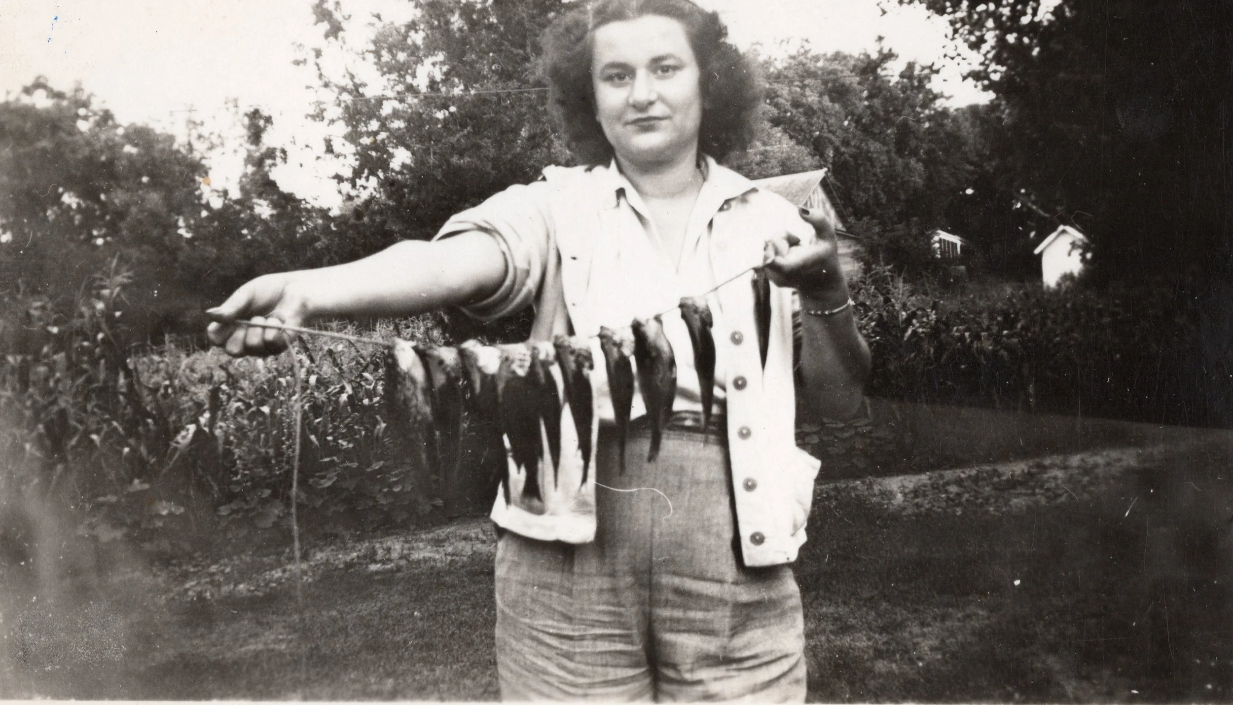 K. Boulos with a string of fish in the Northwoods. 