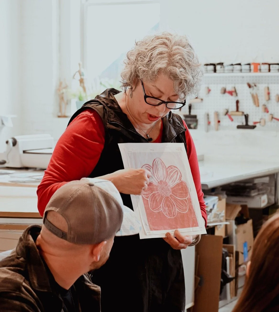 Printmaker and educator Denise Markbreit leading a Lino Block Printmaking Workshop in her downtown Asheville, NC professional printmaking studio.