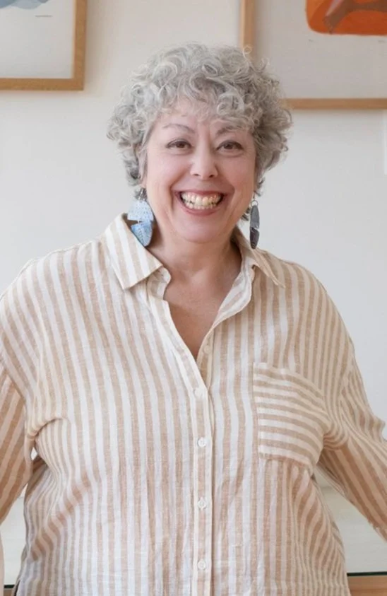 Portrait of smiling Asheville, NC award winning fine art printmaker and studio/gallery owner Denise Markbreit.