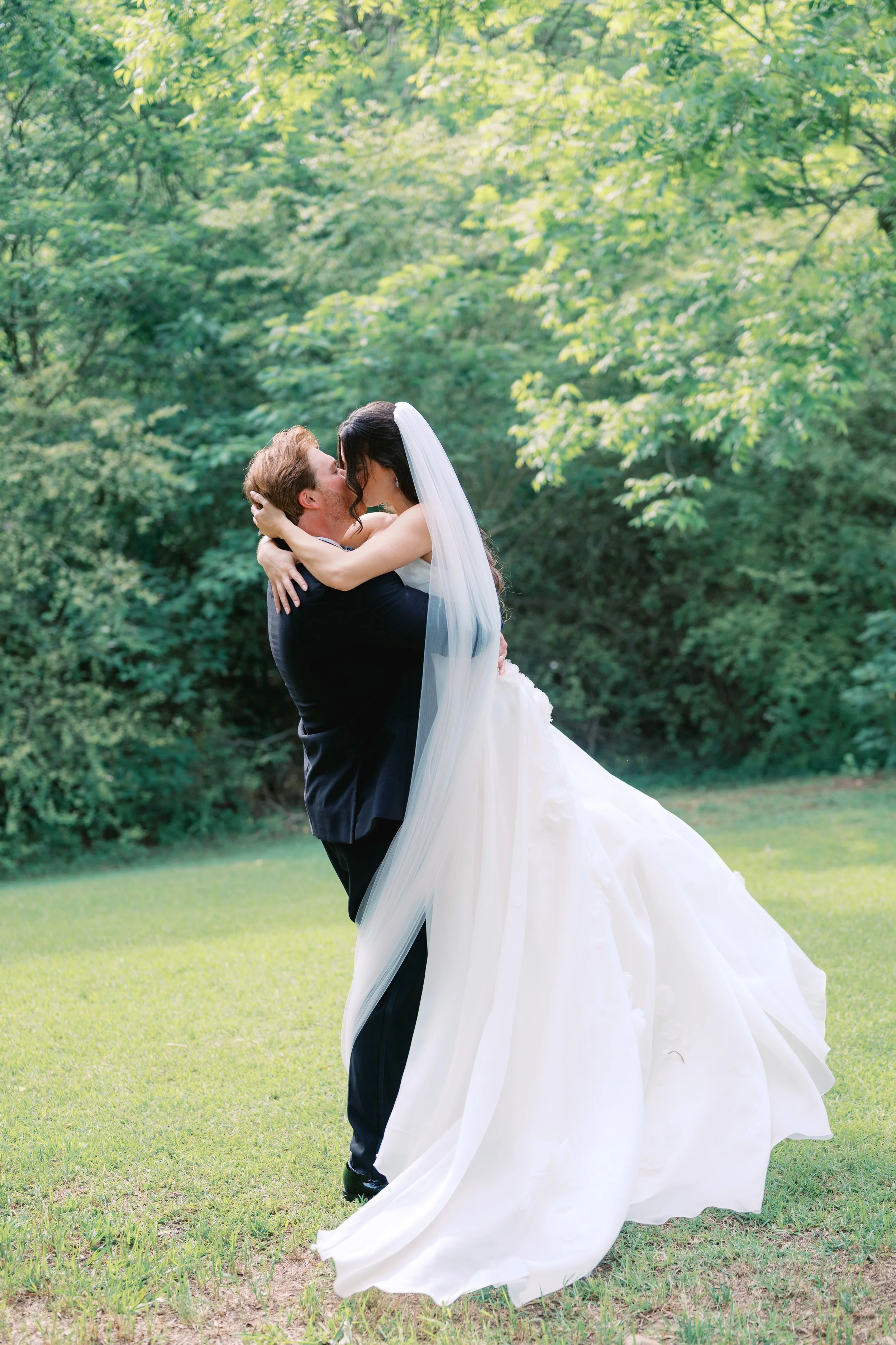 bride and groom kissing portrait