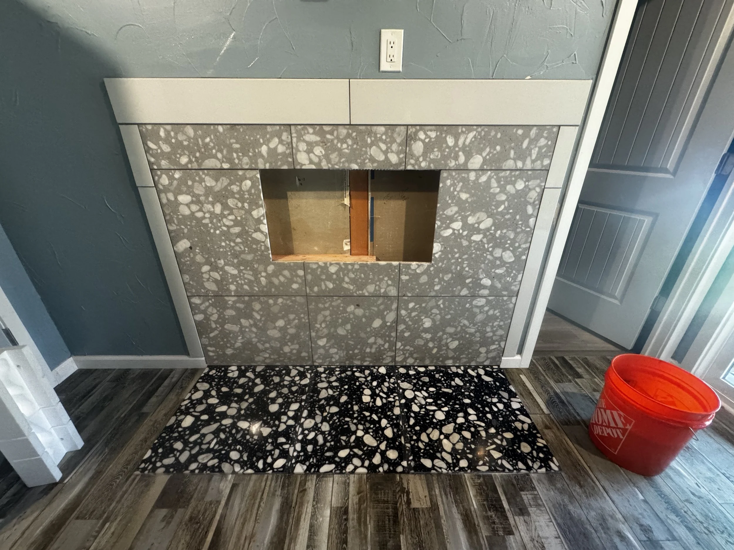 Custom tile fireplace installation by Lehman Construction in Roseburg, Oregon.