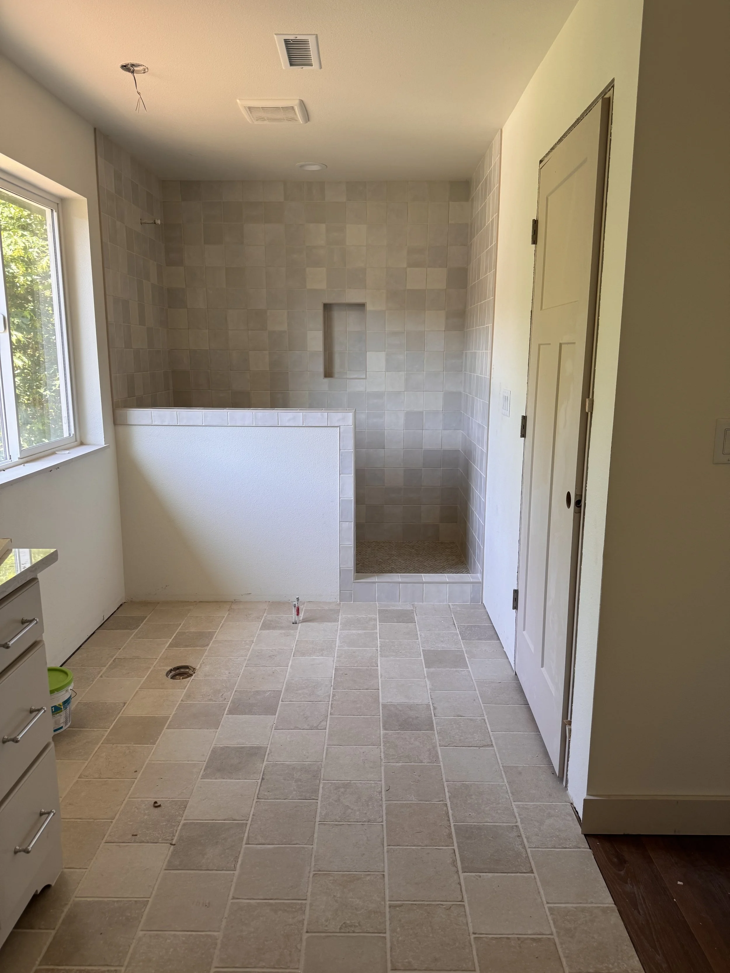 Bathroom remodel with a custom tile shower and flooring by Lehman Construction in Roseburg, Oregon.