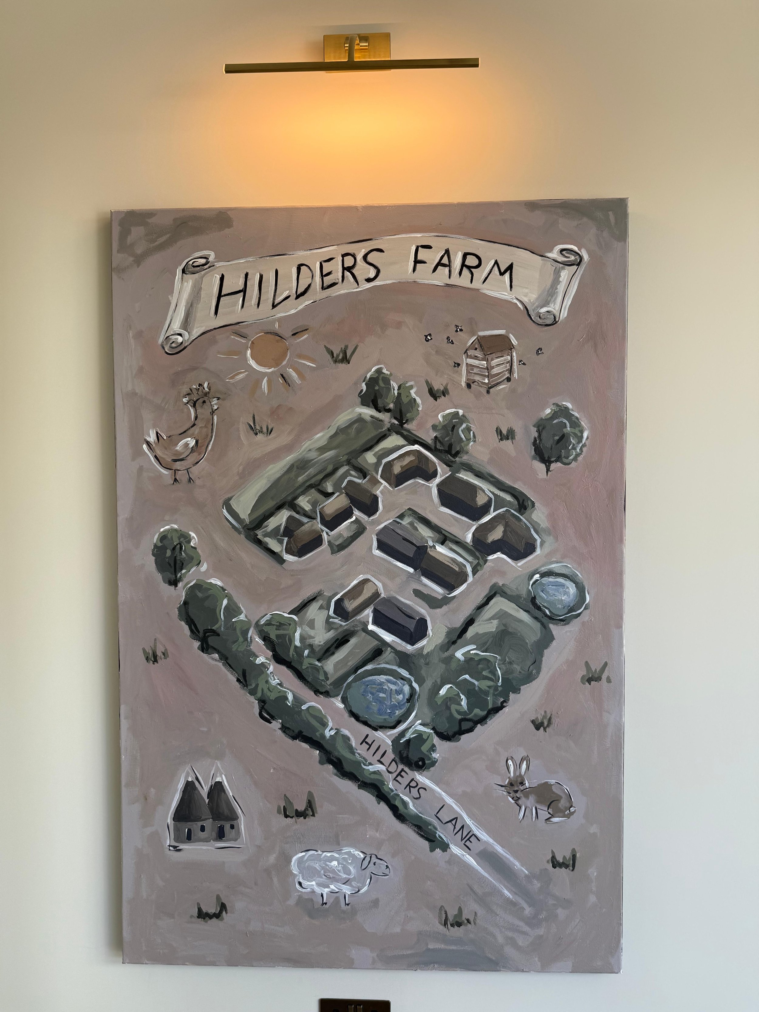 Fun artwork of a farm with peach tones and buildings