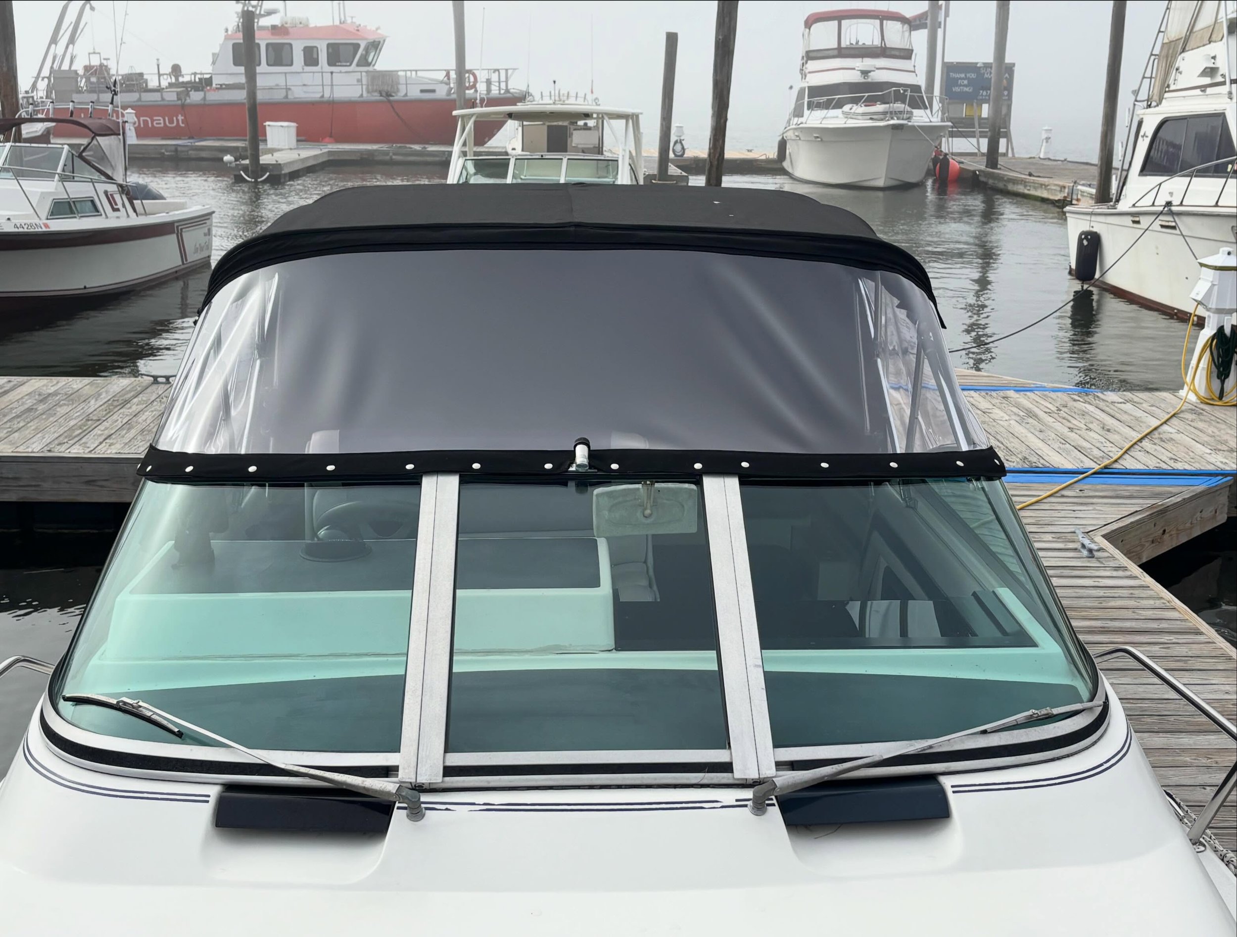 This Scarborough Maine 28ft S2 has a new summer look!  Canvas and clear upgraded to Sunbrella black and Strataglass. Looks good on you!