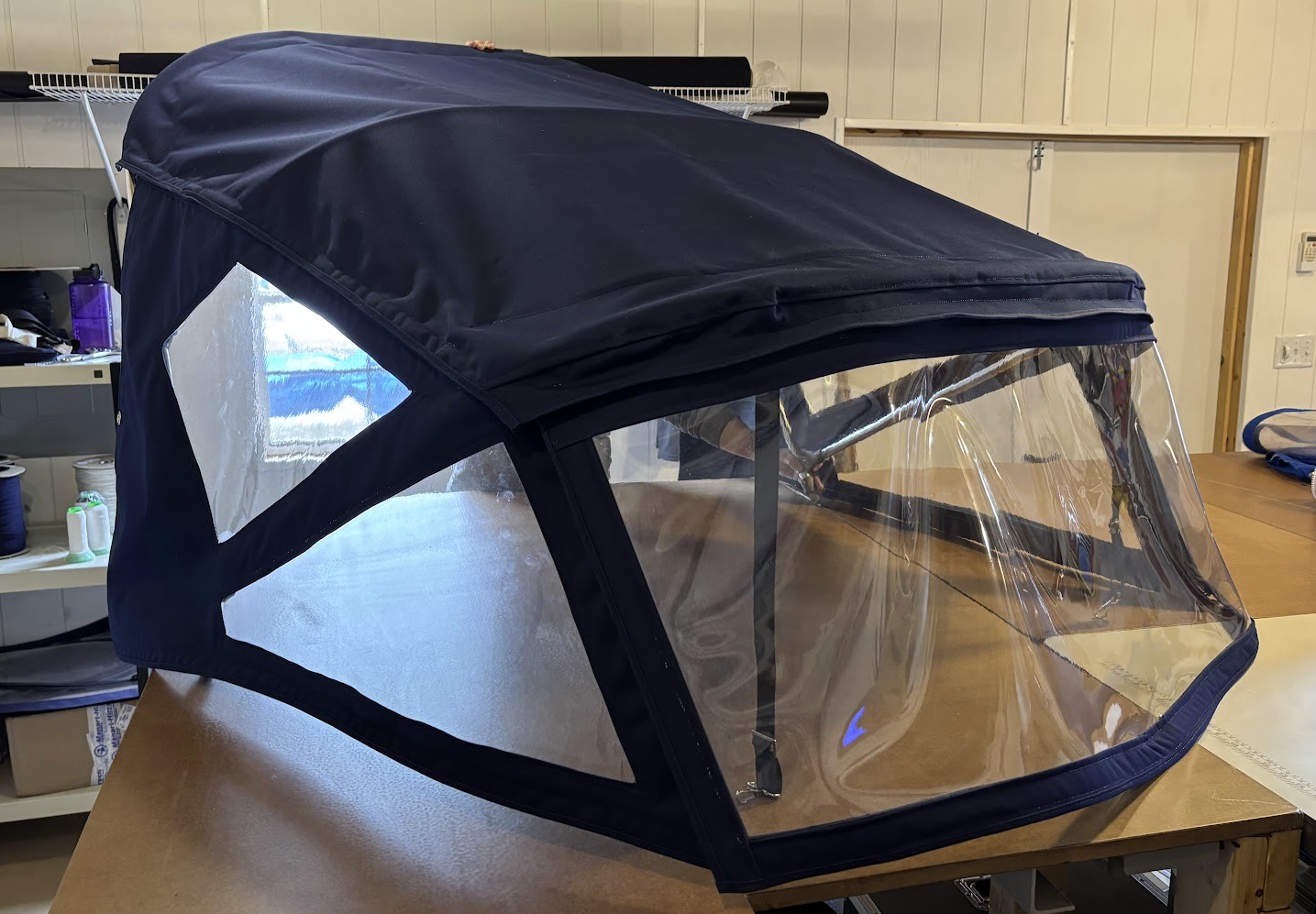 Custom marine canvas boat enclosure with clear vinyl windows