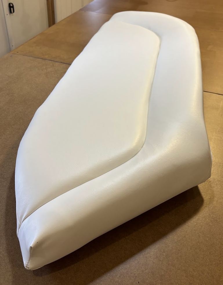 Custom upholstered boat seat cushion with marine-grade vinyl