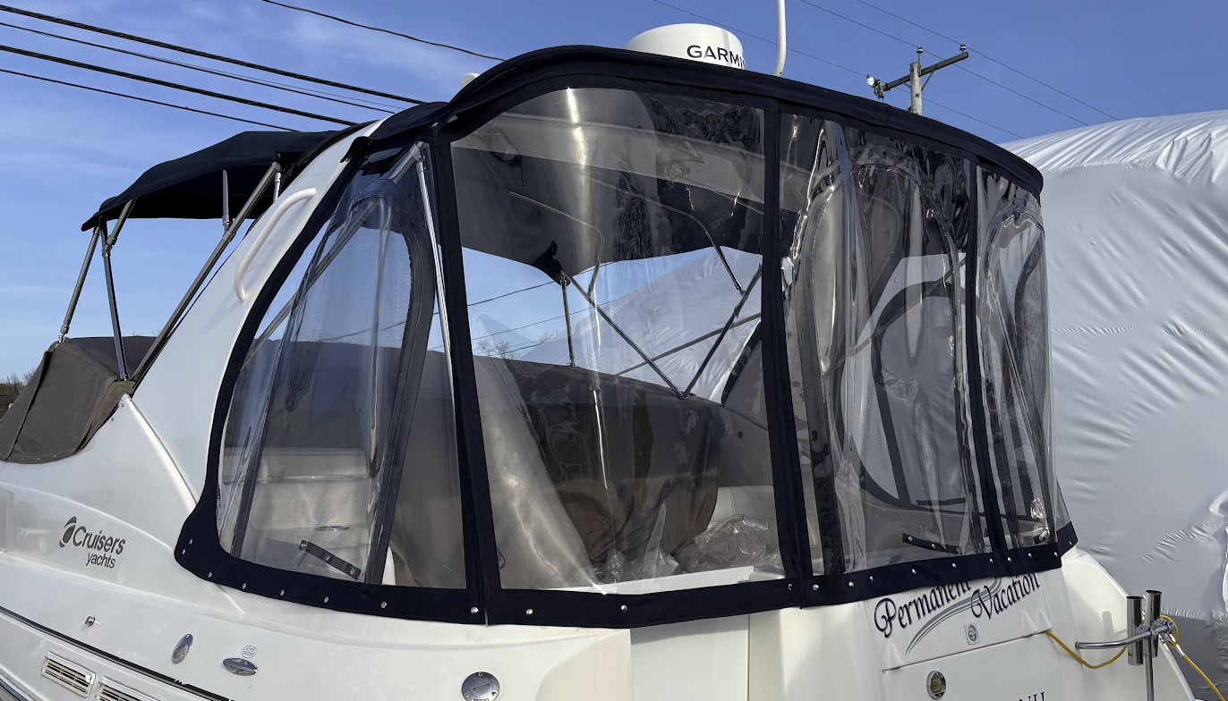 Custom full boat enclosure with clear vinyl windows and marine canvas