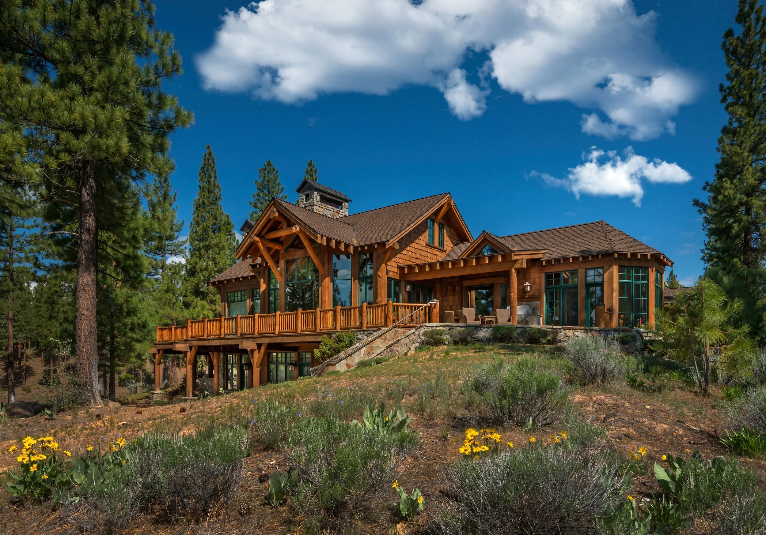 Custom log home with stonework, photo by Vance Fox