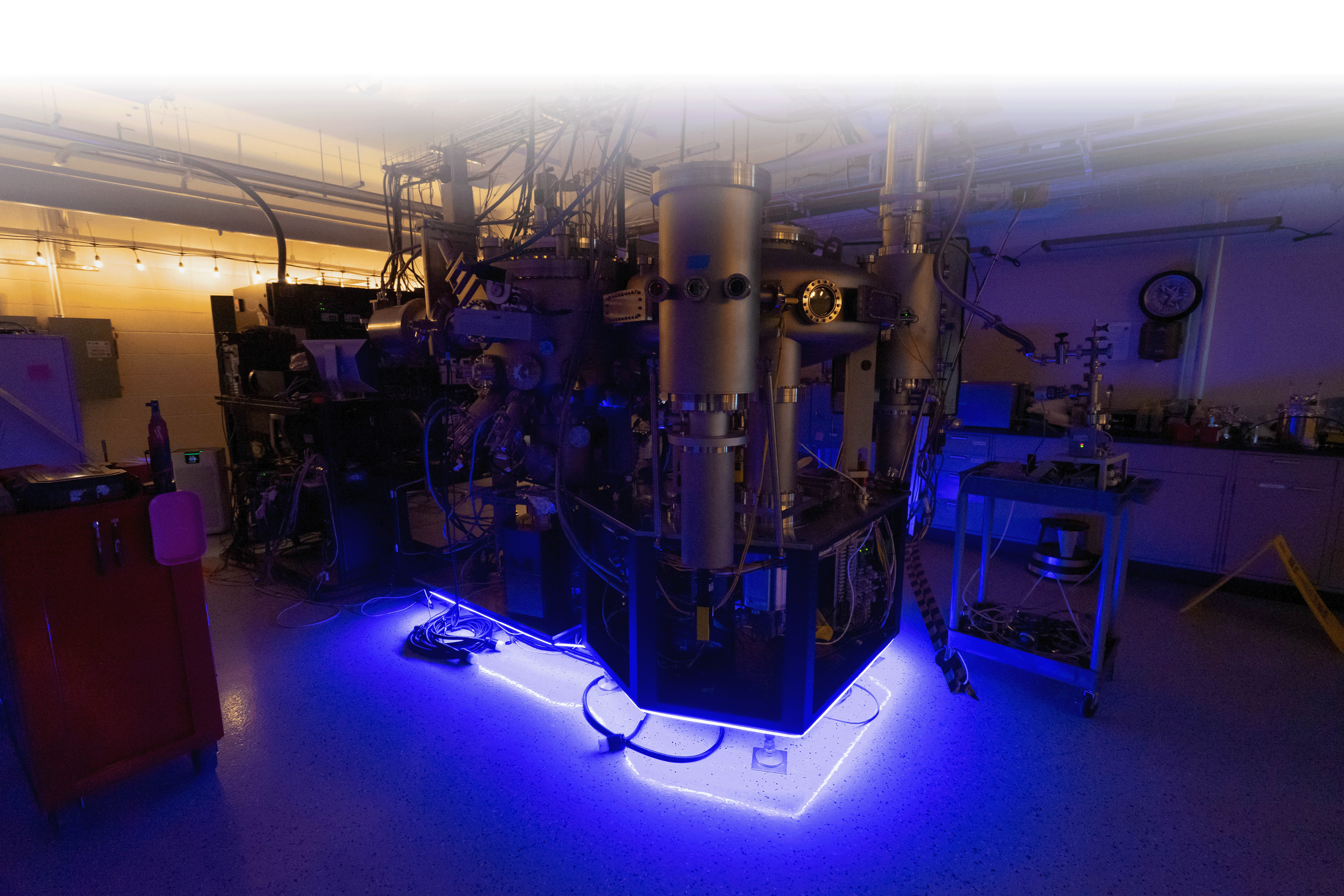 nighttime photo of molecular beam epitaxy system used at Synergy
