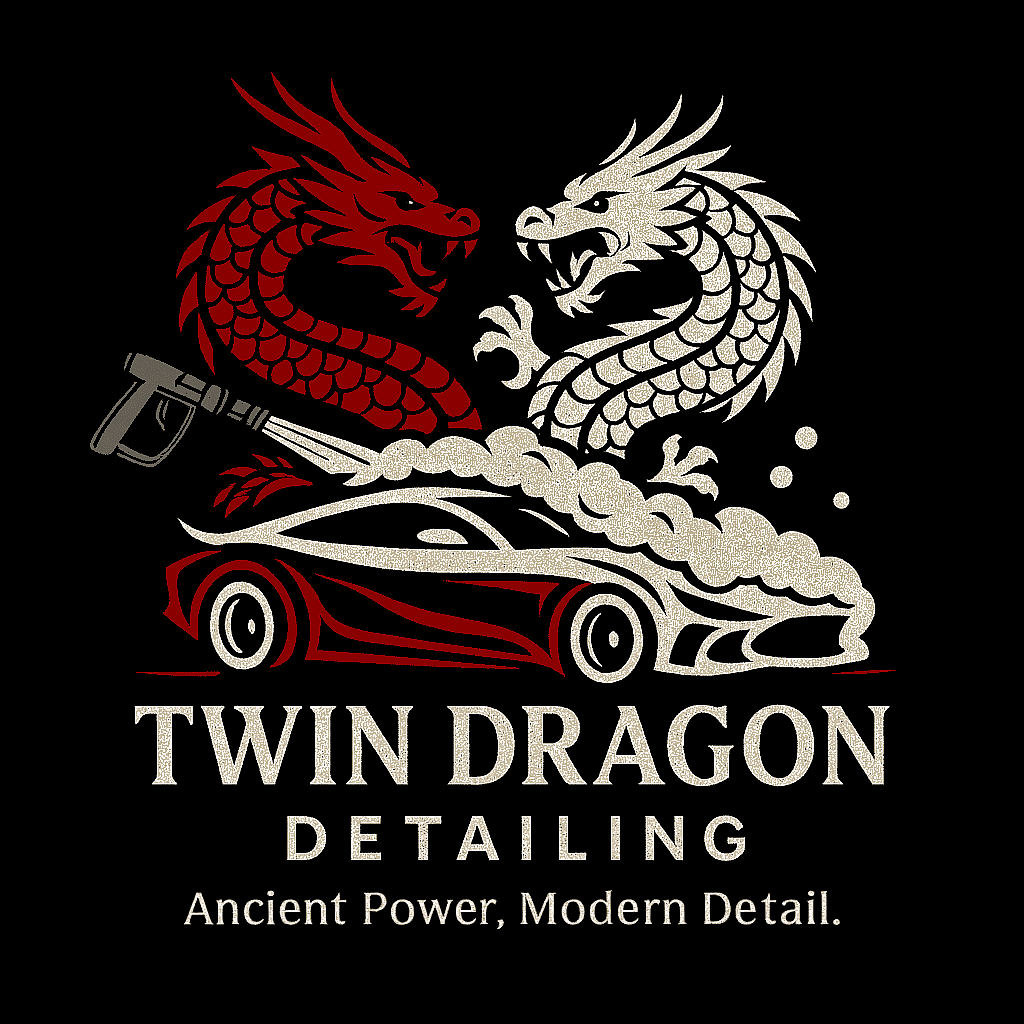 Logo for Twin Dragon Detailing featuring a red and white dragon emerging from a car with smoke, and holding a spray gun, with the slogan 'Ancient Power, Modern Detail'.