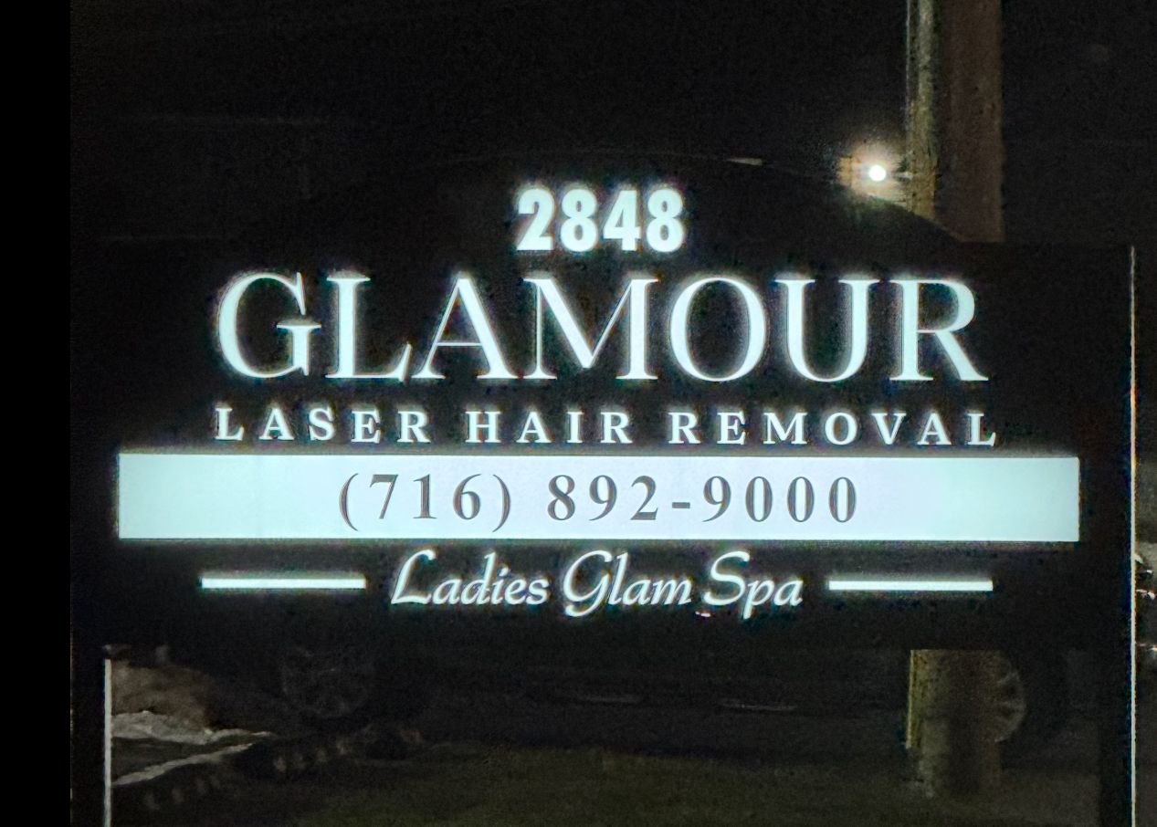  illuminated sign for a laser hair removal and spa business with the text "Glamour," phone number, and slogan "Ladies Glam Spa."