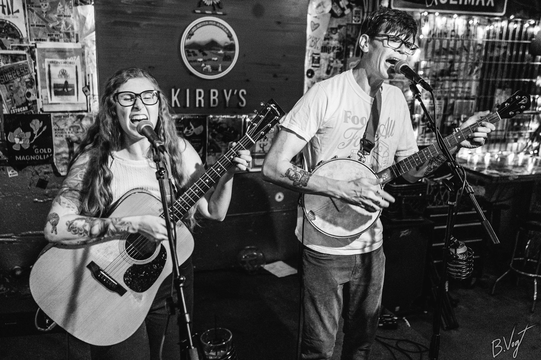 Black and white photo by Vogt Photography of Rachel & Griffin playing at Kirby's Beer Store in Wichita, Kansas.