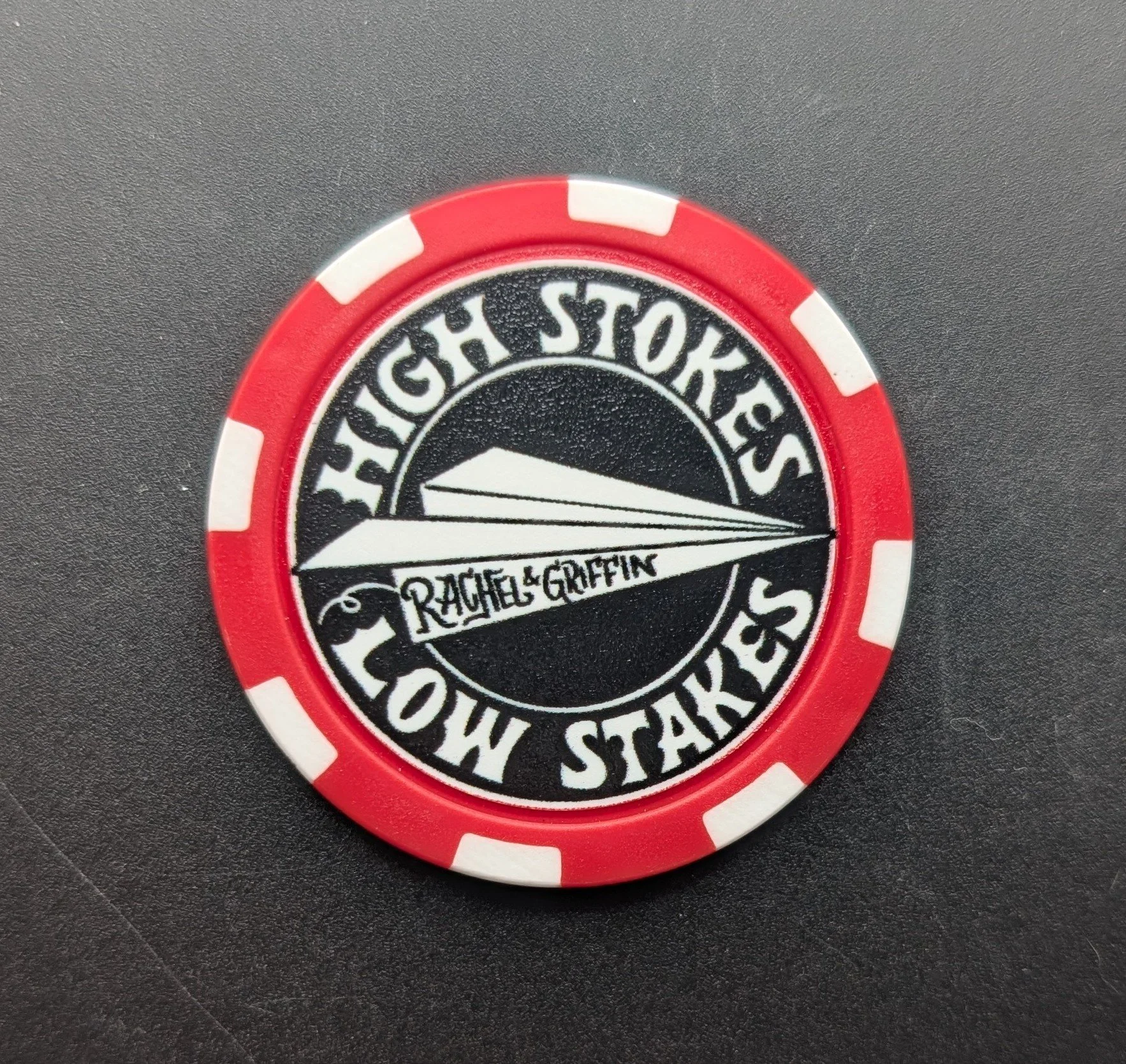 red poker chip with shelby criswell's high stokes design