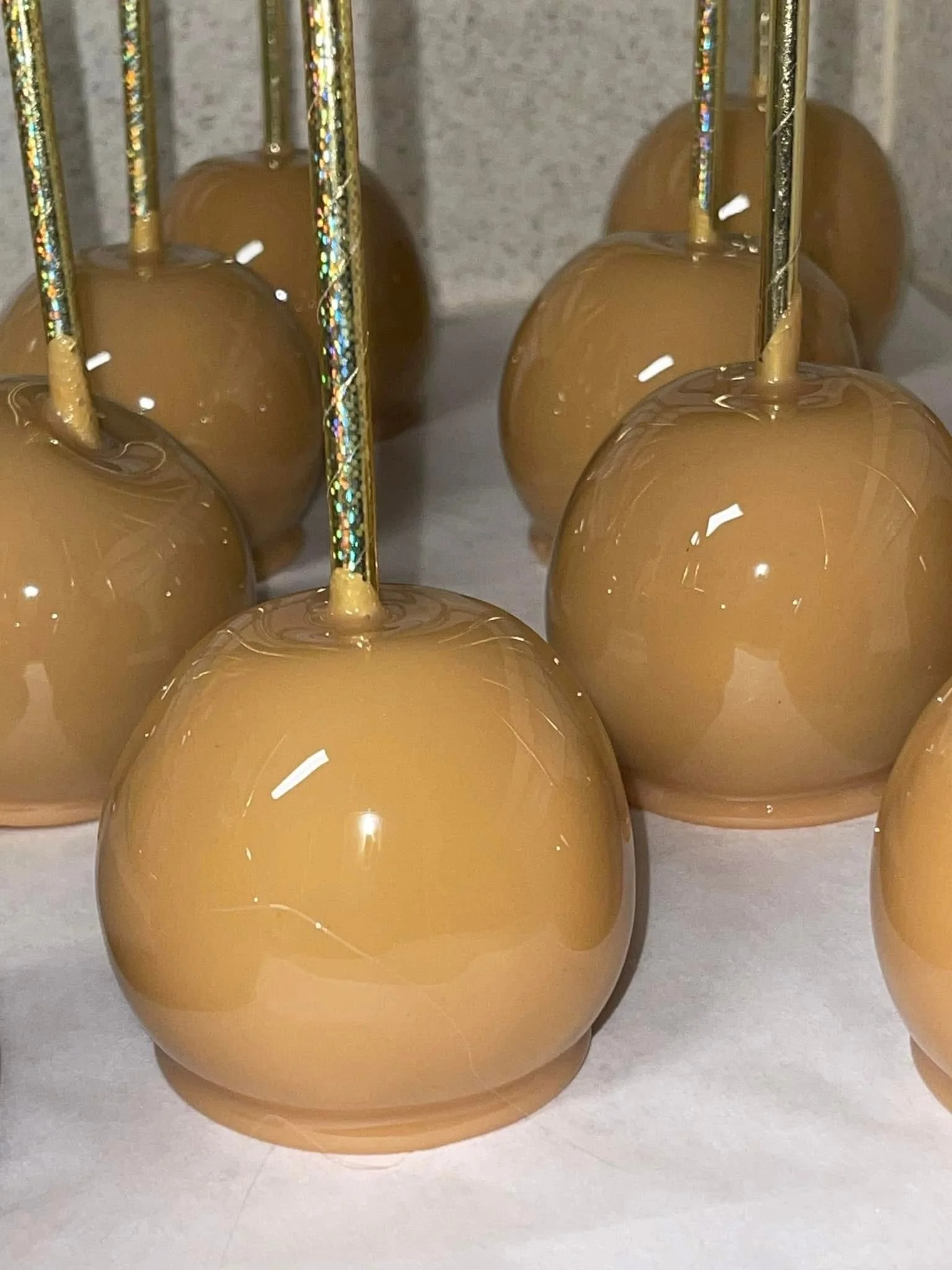 Caramel apples on sticks.