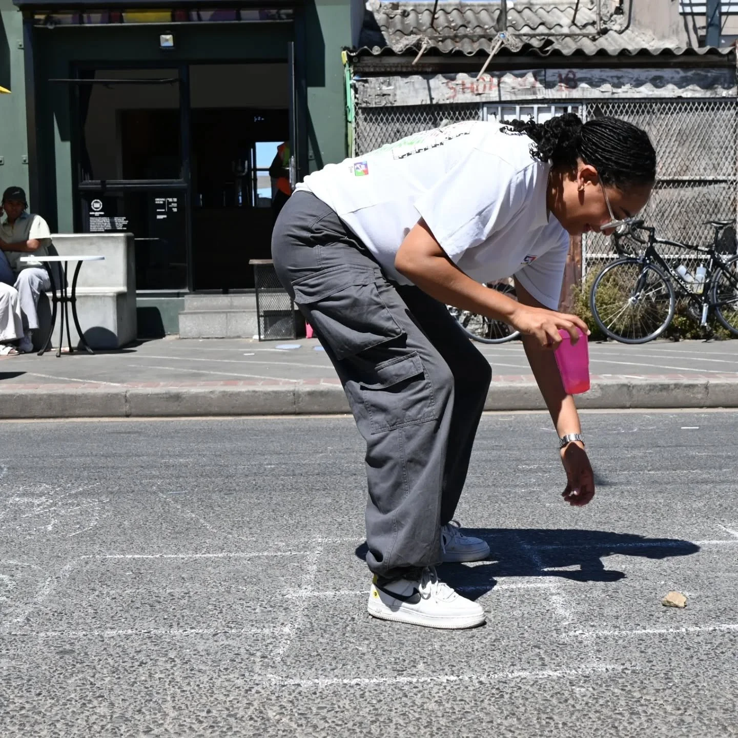 Once a month, Lerotholi Avenue becomes a playground.
Cars disappear, chalk appears, and the street belongs to people again.
Watching this moment took me straight back to my childhood in Libreville. Same game. Same gesture. Different city.

🌍 This ga