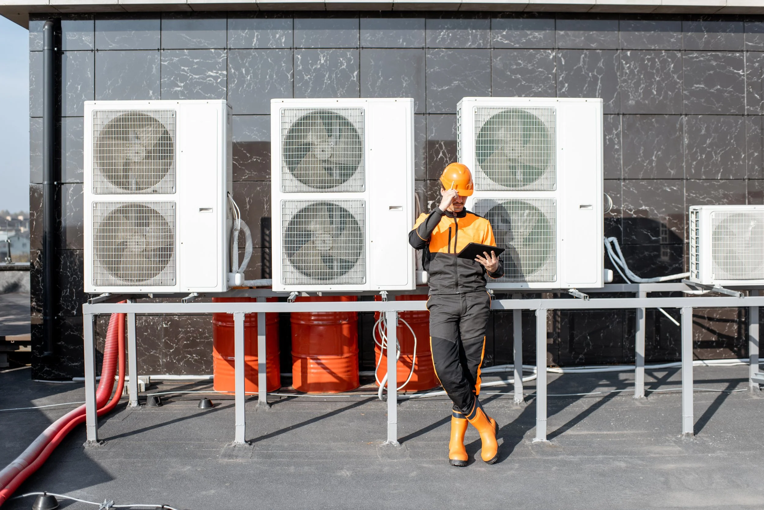 workman-servicing-air-conditioning-or-heat-pump-wi-2025-04-01-21-59-12-utc.jpg