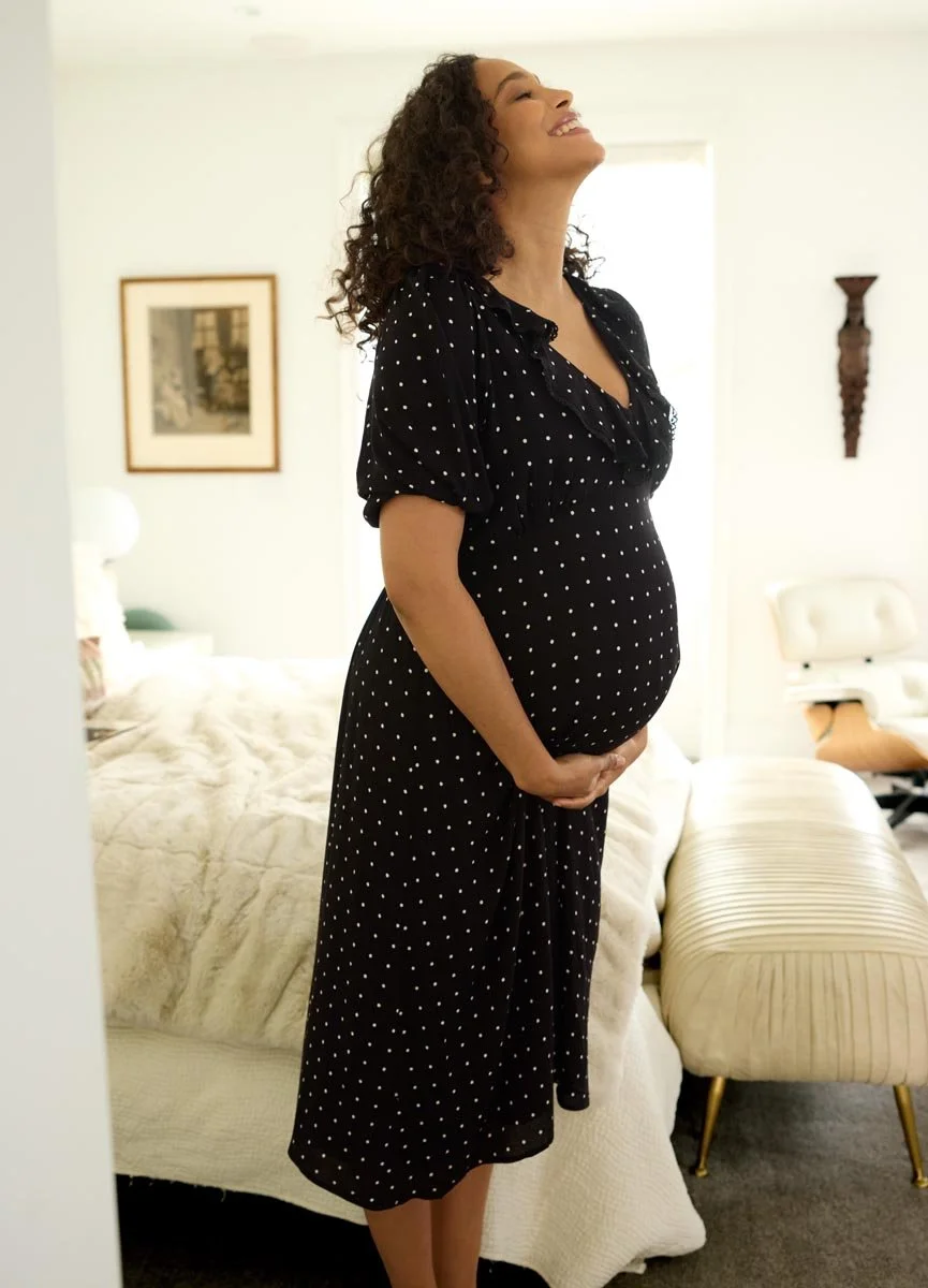 N3420-RuffleV-NeckDress-Black_WhiteDot_02_SHOT_BEDROOM_4895.jpg