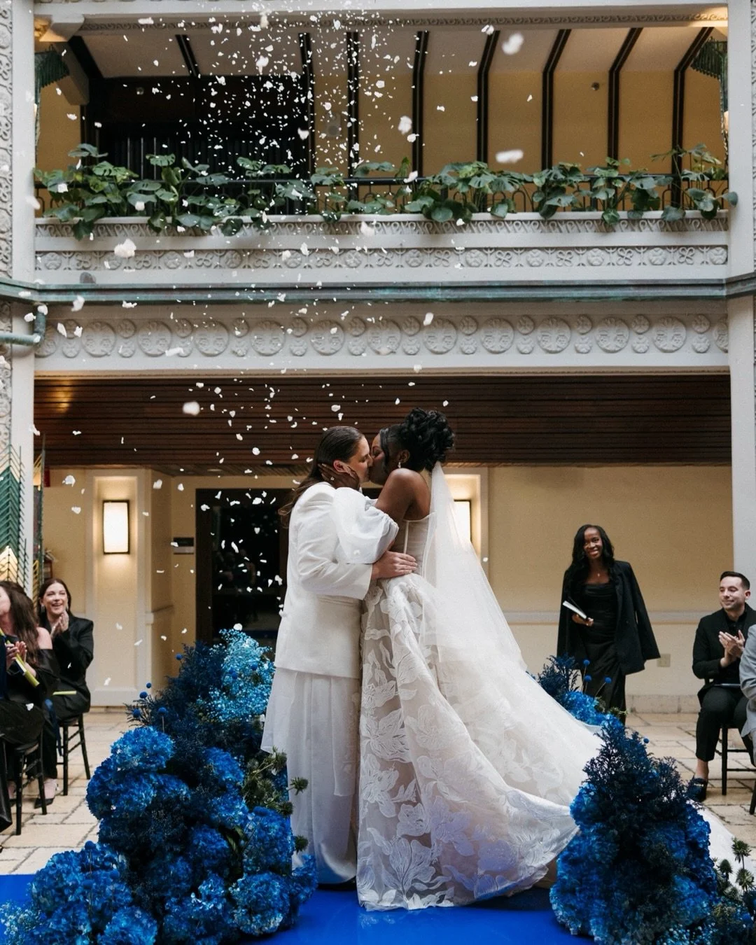 Two brides. One unforgettable &lsquo;I do.&rsquo; ✨A love story surrounded by those who matter most &mdash; layered in cobalt blue, mirrored reflections, and romantic simplicity.

A Modern Editorial Wedding in Shades of Cobalt Blue for Two Brides in 