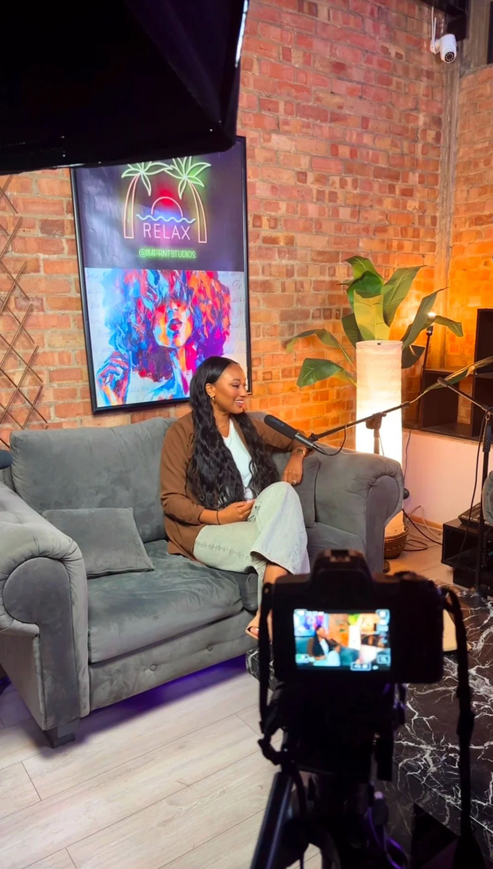 Melissa Labiran recording a podcast in a studio