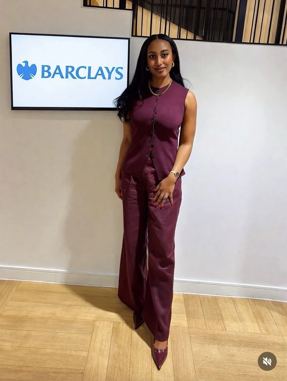 Melissa Labiran beside a Barclays sign