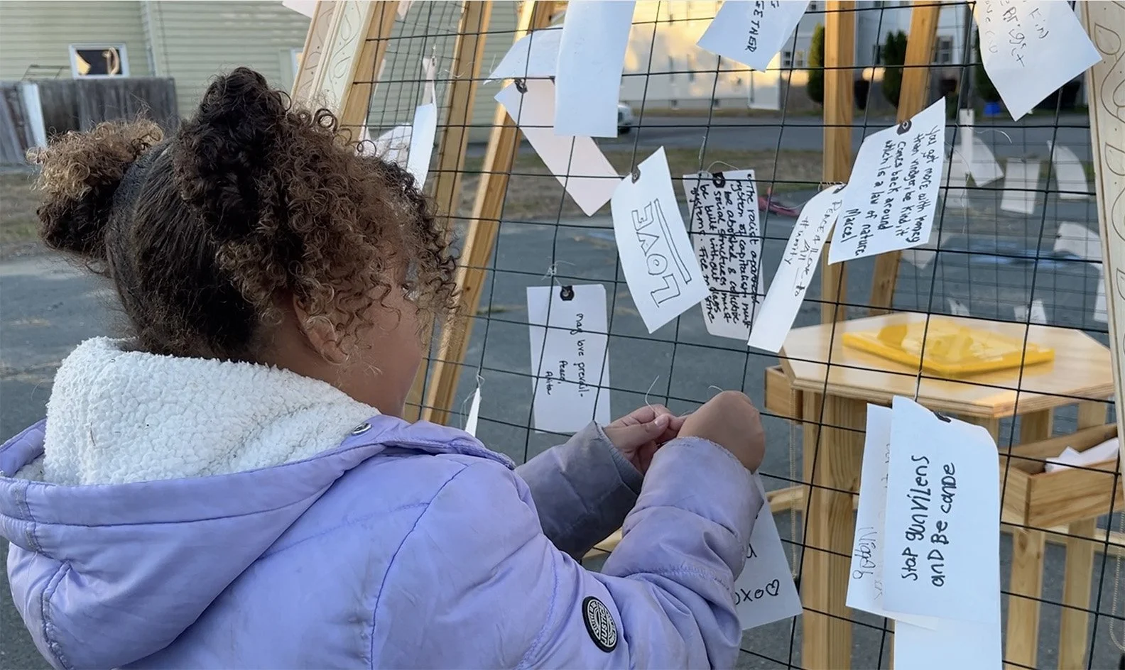 girl hanging up message.jpg
