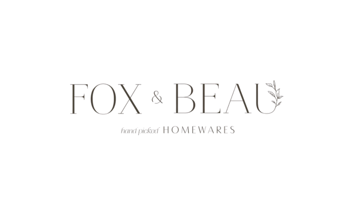 Logo for Fox & Beau, a homewares brand, with the text "fox & beau" and a small decorative leaf element.