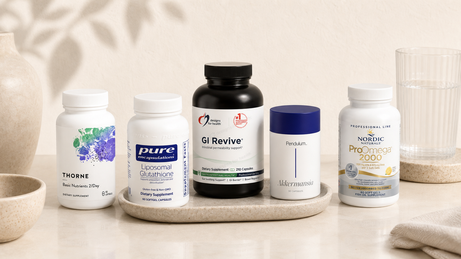 Professional-grade supplement bottles arranged on a light stone surface