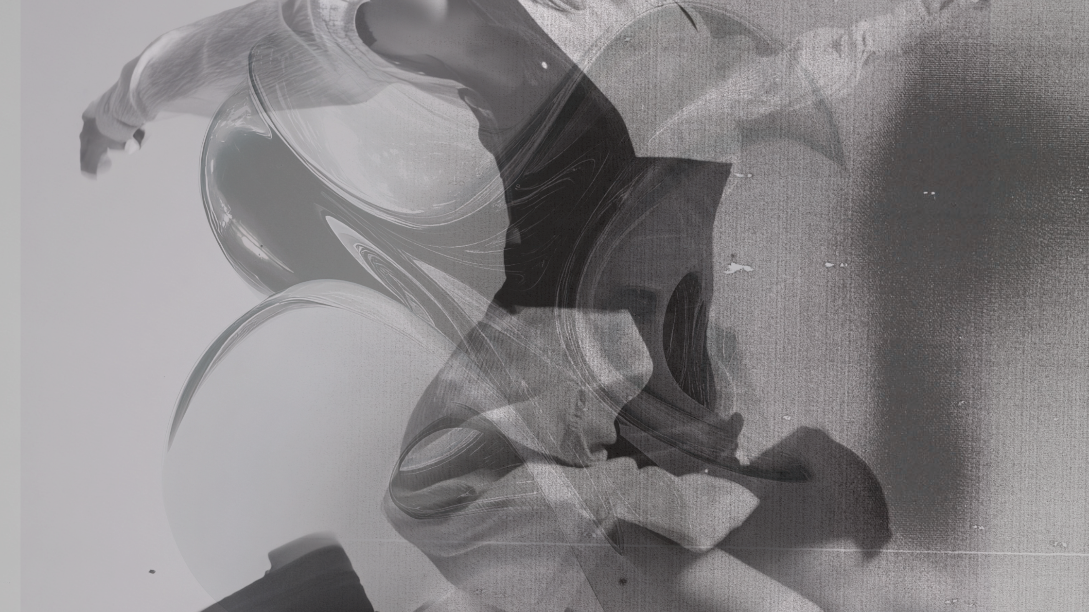 Abstract black and white swirling patterns and shapes.