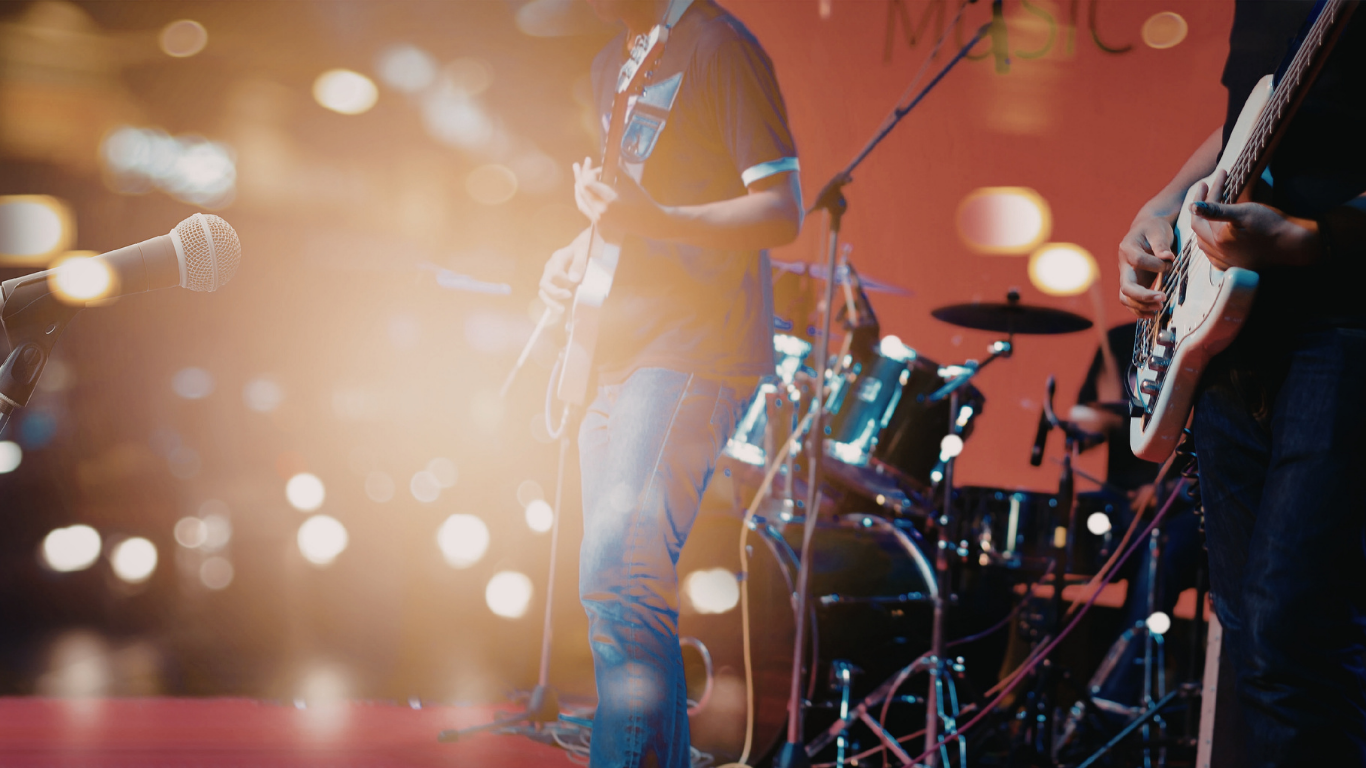 How Queer Artists Can Get Booked: A Guide from a Queer Music Agency