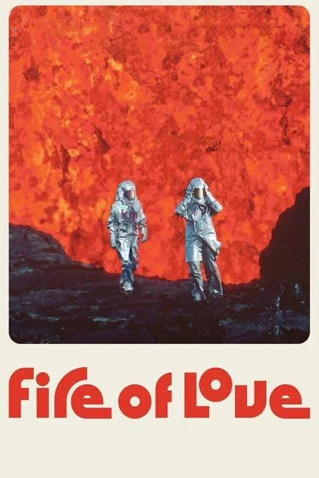 Two scientists in protective suits standing near a large flowing lava wall with the text 'fire of love' at the bottom.