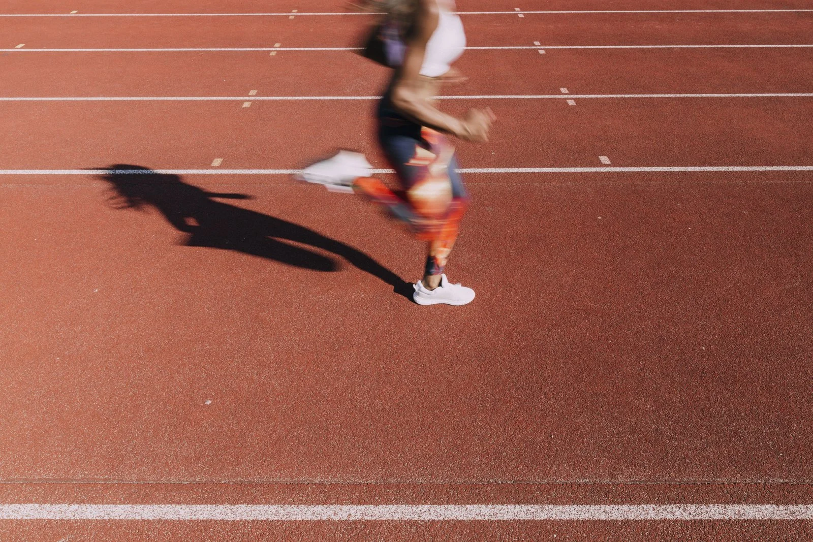 A woman running on a track
