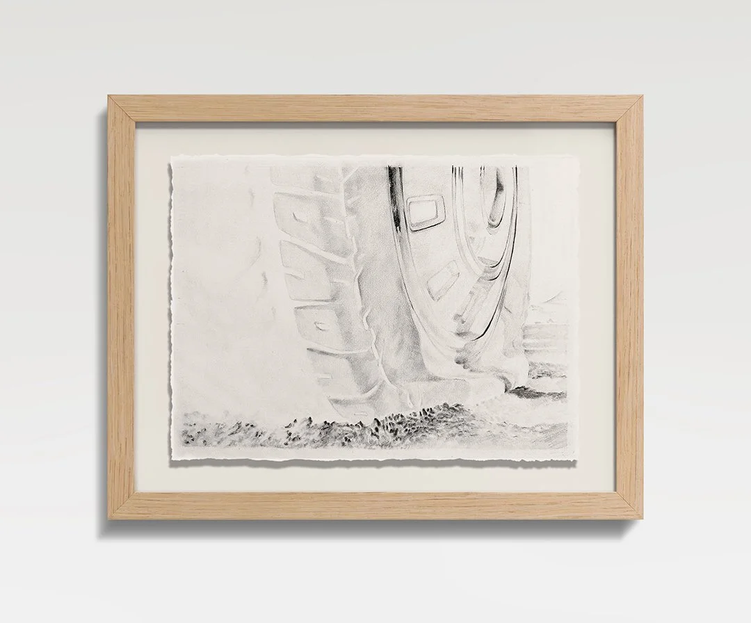 Frame VII: Flat Tire, 2026, Graphite on paper, oak frame, 15.5 in H × 19 in W × 1.5 in D (39.4  × 48.3  × 3.8 cm) 
