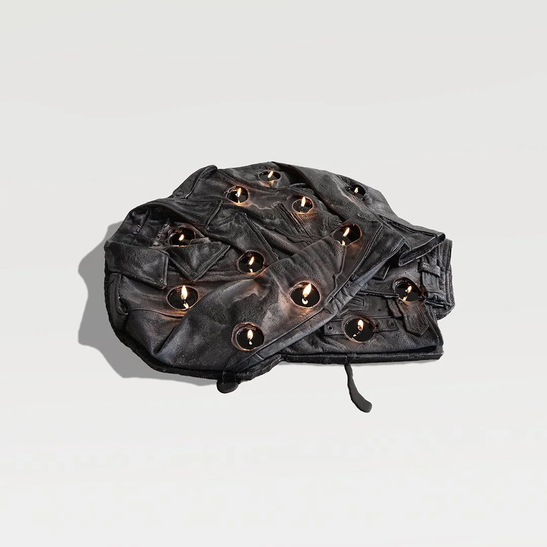 Drop My Body, 2026, Paraffin wax, cotton wicks, leather dye, 32 in L x 28 in W x 4 in H  (81.3  × 71.1  × 10.2 cm)